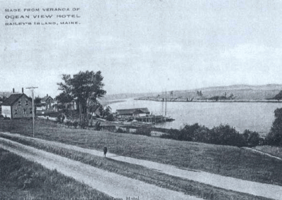 The Ocean View Hotel looked out of Mackerel Cove and to Abner's Point. The road is Rt. 24. The Ocean View Hotel is no longer standing. Early 1900's.
