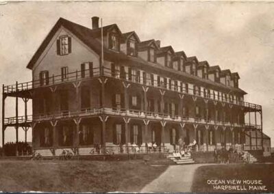 This was the biggest of the Hotels,built in 1884 first called Lawson’s Hotel . In 1901 it was bought by George Cambell who also owned the Merriconeag Hotel at the point 1901-1905. During it’s declining years one attempt at survival was to build a big swimming pool to attract guests. The foundation of this pool is still visible in the back yard of Mr. & Mrs. Ed Burkes’ house. The hotel burned in 1927 a mysterious 3 A.M. firm and story has it that the flames were so high the glow could be seen all the way to Brunswick. It burned so fast that the fire dept. could not save a thing and it was so hot that the cast iron tubs from the bathrooms three floors high actually stacked inside each other when the wooden floors gave way. Other owners were A.S. Young 1905-1911, Harry Lightfoot 1914, and Mrs. Lena Perry 1926 when it burned.
